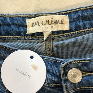 EN CRÉME multi patched denim skirt